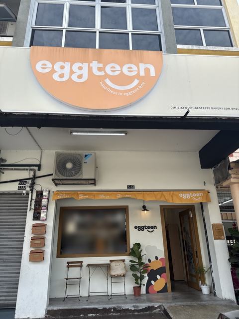 The Eggteen shopfront with its orange half-moon sign